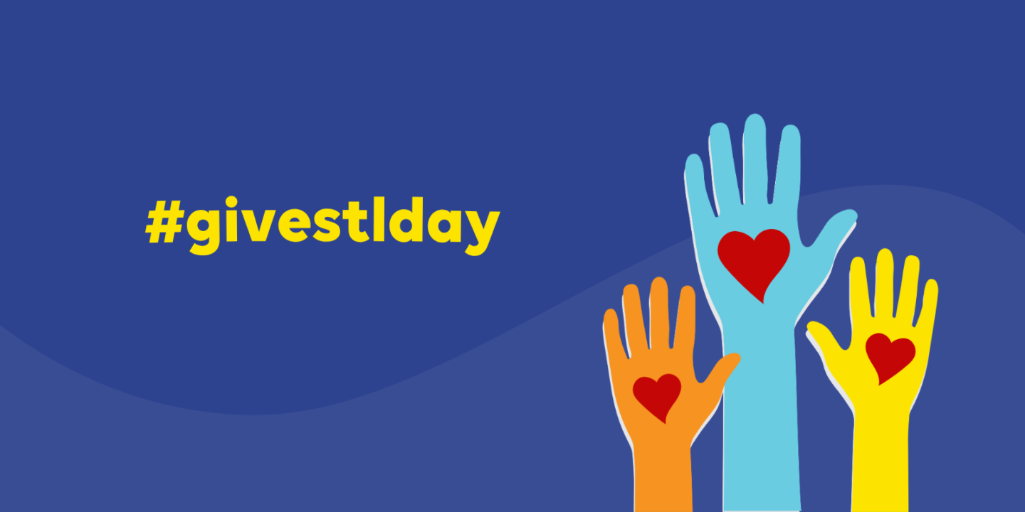 Dark blue banner with a large yellow hashtag on the left and three raised colorful hands with red hearts on the right.